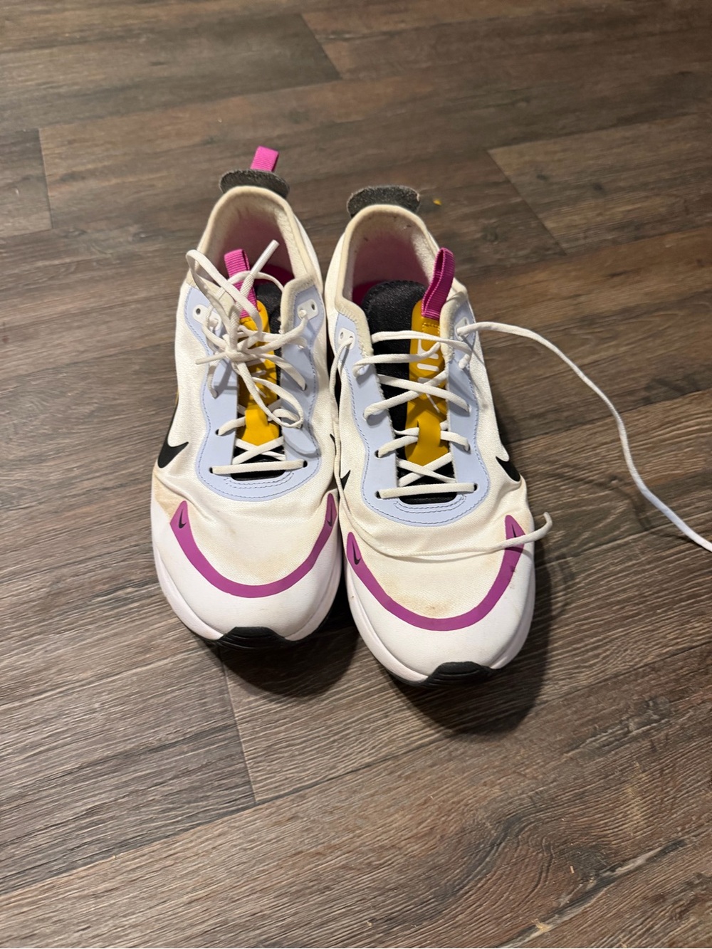 Nike Women’s White Athletic Sneakers with Pink and Yellow Accents